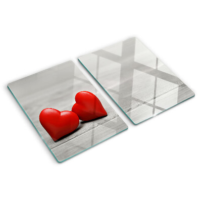 Tabla para cortar Corazones rojos sobre un fondo de madera