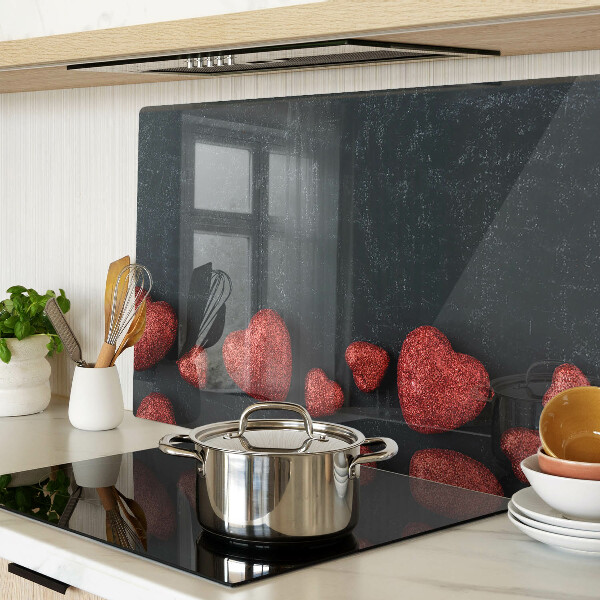 Tabla de cortar de cristal Corazones rojos sobre un fondo oscuro