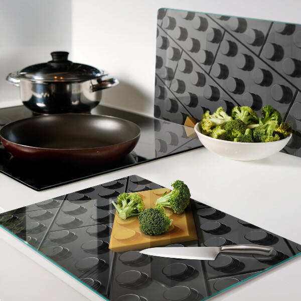 Tabla de cortar de cristal Ladrillos LEGO sobre fondo negro