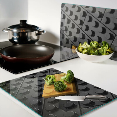 Tabla de cortar de cristal Ladrillos LEGO sobre fondo negro