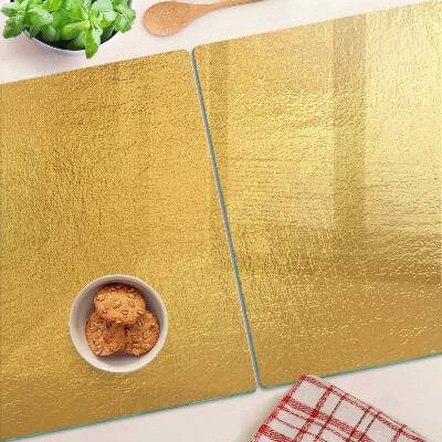 Tabla de cocina Superficie dorada con reflejos.