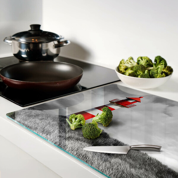 Tabla de cortar Un faro en el paisaje