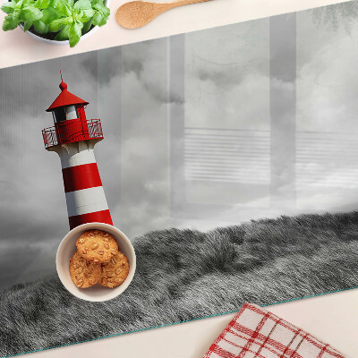 Tabla de cortar Un faro en el paisaje