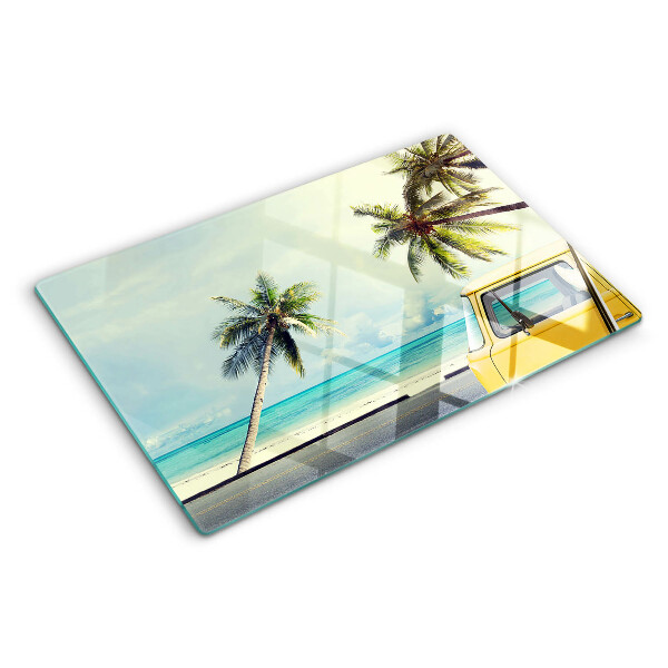 Tabla para cortar Playa con palmeras y un coche.