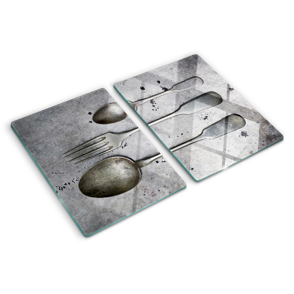 Tabla de cortar Cubiertos sobre un fondo de hormigón