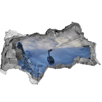 Dziura 3d w ścianie naklejka Górska kolejka linowa nad chmurami