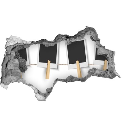Vinilo efecto 3d pared rota irregular Una pared dañada con marcos de fotos.