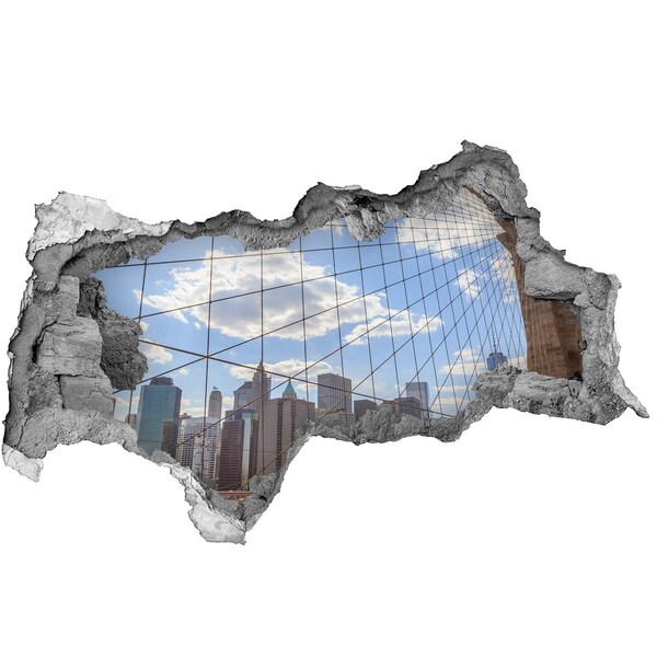 Vinilo adhesivo boquete en la pared rota Vista de la ciudad a través de un agujero en la pared.