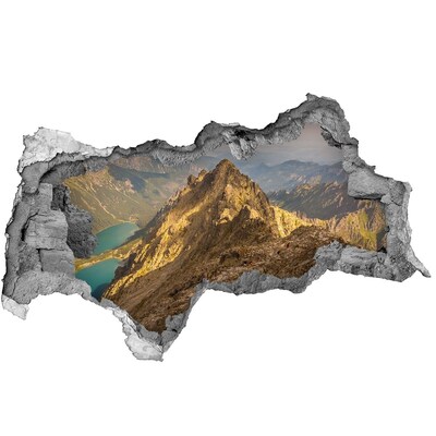 Fotomural autoadhesivo efecto agujero 3d Paisaje de montaña a través de un agujero en la pared.