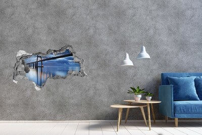 Pegatina decorativa agujero en la pared 3d Un puente sobre el agua en una escena nocturna.