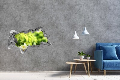Fotomural autoadhesivo efecto agujero 3d Una flor en un jardín verde.