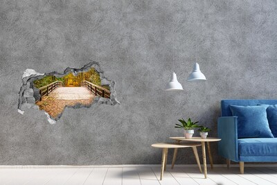 Vinilo adhesivo boquete en la pared rota Un puente en el bosque otoñal.