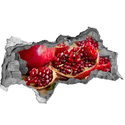 Naklejka 3D dziura na ścianę Owoc granatu w dziurze w ścianie