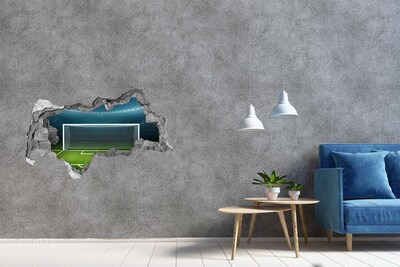 Vinilo efecto 3d pared rota irregular El estadio de fútbol detrás del agujero en el muro.