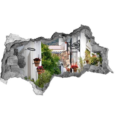 Fotomural autoadhesivo efecto agujero 3d Una calle encantadora en un pueblo blanco.