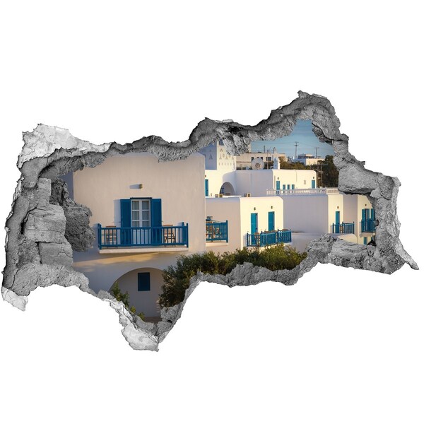 Pegatina decorativa agujero en la pared 3d Vista de casas blancas con ventanas azules.