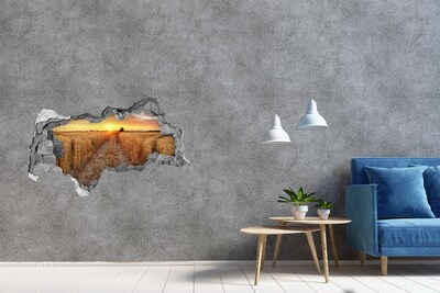 Fotomural autoadhesivo efecto agujero 3d Puesta de sol dorada sobre un campo de cereales