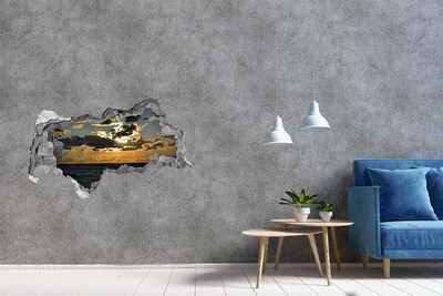 Vinilo adhesivo boquete en la pared rota Puesta de sol sobre el mar