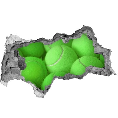 Vinilo efecto 3d pared rota irregular Pelotas de tenis verdes detrás de la pared.