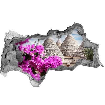 Fotomural autoadhesivo efecto agujero 3d Trulli en Apulia con flores