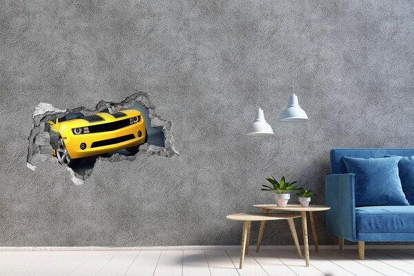 Vinilo adhesivo boquete en la pared rota Una pared en ruinas con un coche amarillo.