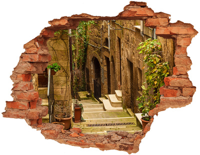 Pegatina agujero en la pared autoadhesiva Una calle encantadora en el pueblo