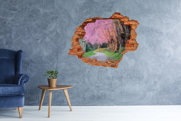Vinilo pared rota 3d efecto realista Un paseo primaveral entre los árboles en flor