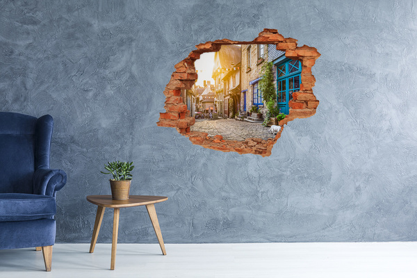 Vinilo pared rota 3d efecto realista Una calle encantadora en el pueblo