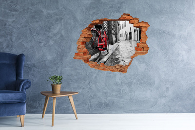 Vinilo pared rota 3d efecto realista Una bicicleta roja en una calle encantadora