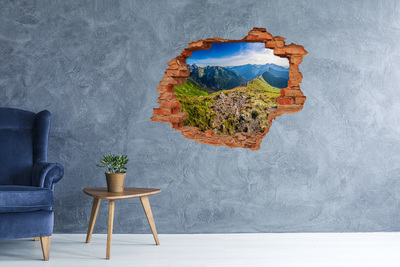 Vinilo pared rota 3d efecto realista Paisaje de montaña a través de un agujero en la pared
