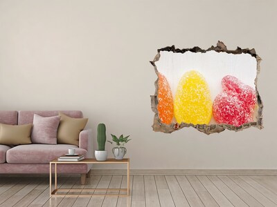 Vinilo pared rota 3d efecto realista Gomitas dulces en un agujero en la pared