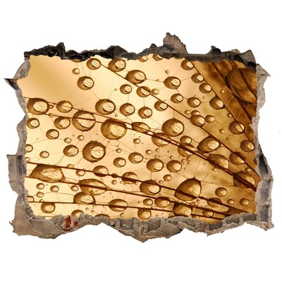 Pegatina de vinilo agujero 3d para pared Una gota dorada sobre un fondo de hormigón