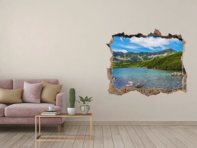 Vinilo pared rota 3d efecto realista Un lago de montaña rodeado de vegetación