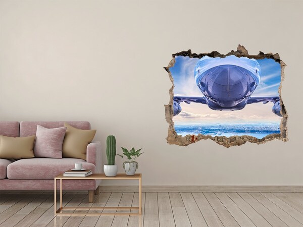 Vinilo pared rota 3d efecto realista Un avión sobre la ciudad