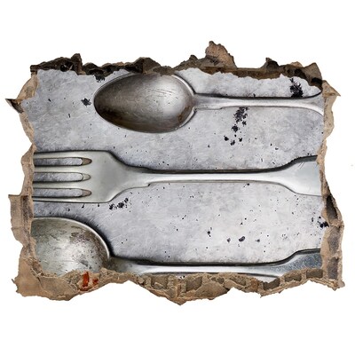 Fototapeta dziura na ścianę Złamana ściana z widokiem na sztućce