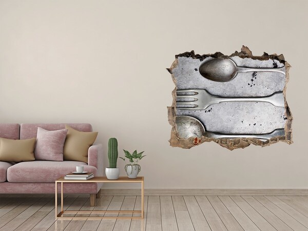 Fototapeta dziura na ścianę Złamana ściana z widokiem na sztućce