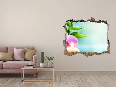Vinilo pared rota 3d efecto realista Un oasis de paz con una flor y una vela