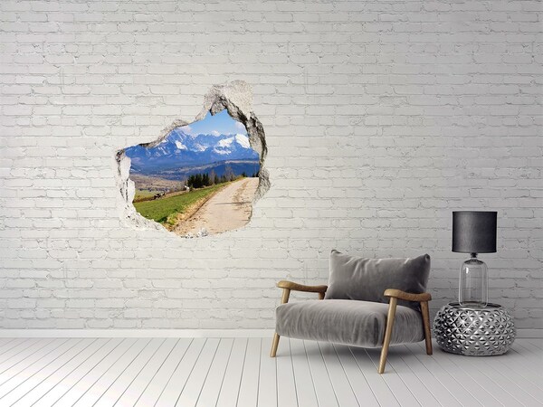 Vinilo adhesivo efecto agujero 3d para casa Paisaje de montaña detrás del agujero en la pared.