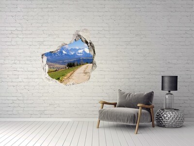 Vinilo adhesivo efecto agujero 3d para casa Paisaje de montaña detrás del agujero en la pared.