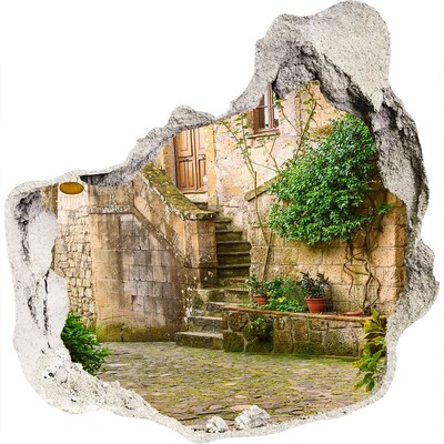 Vinilo decorativo boquete pared irregular Escaleras encantadoras en un pueblo antiguo