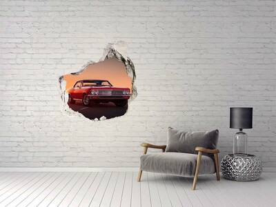 Vinilo decorativo boquete pared irregular Coche clásico con el atardecer como telón de fondo