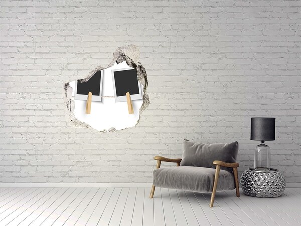 Pegatina pared rota trampantojo decorativo Una pared dañada con marcos de fotos.