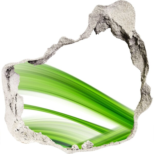 Vinilo decorativo boquete pared irregular Prado verde a través de un agujero en la pared.