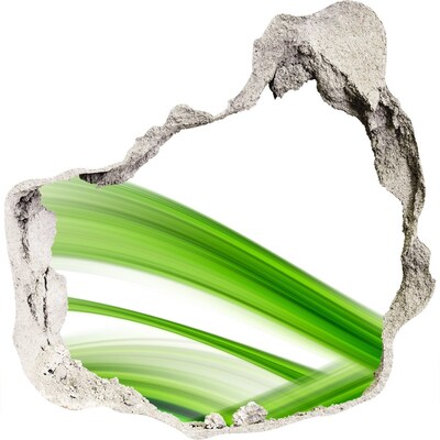 Dziura 3d fototapeta naklejka Zielona łąka przez dziurę w ścianie