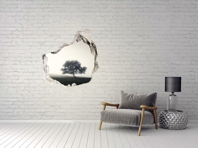 Vinilo adhesivo efecto agujero 3d para casa Un claro brumoso con un árbol solitario.