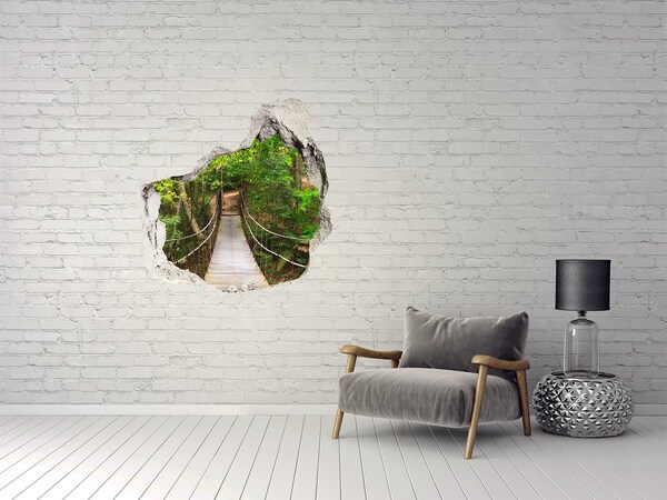 Vinilo decorativo boquete pared irregular Un puente entre la vegetación