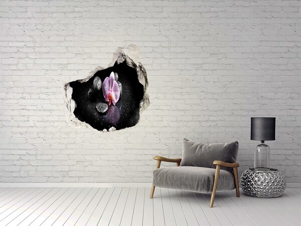 Vinilo decorativo boquete pared irregular Flor de orquídea rodeada de piedras.