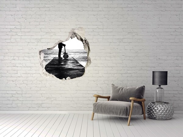 Vinilo decorativo boquete pared irregular Músico en el muelle