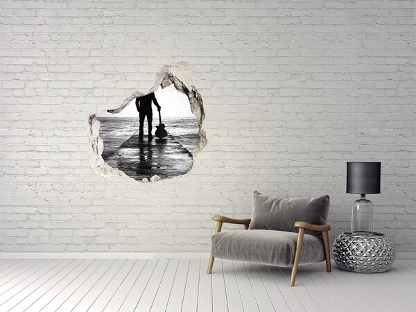 Vinilo decorativo boquete pared irregular Músico en el muelle