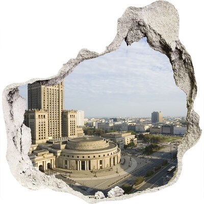 Vinilo decorativo boquete pared irregular Vista de Varsovia desde un agujero en la pared